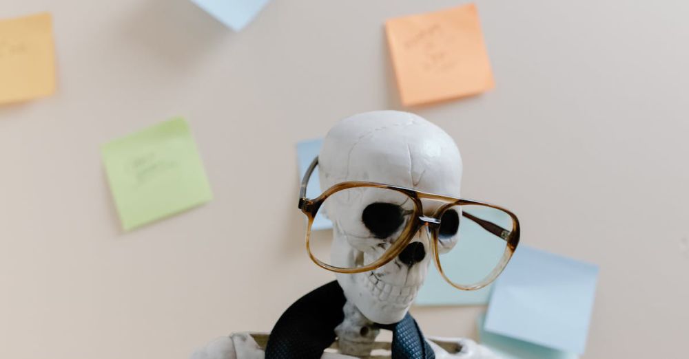 Post-It Notes - Humorous skeleton model with glasses and tie, illustrating burnout and overwork in office environment.