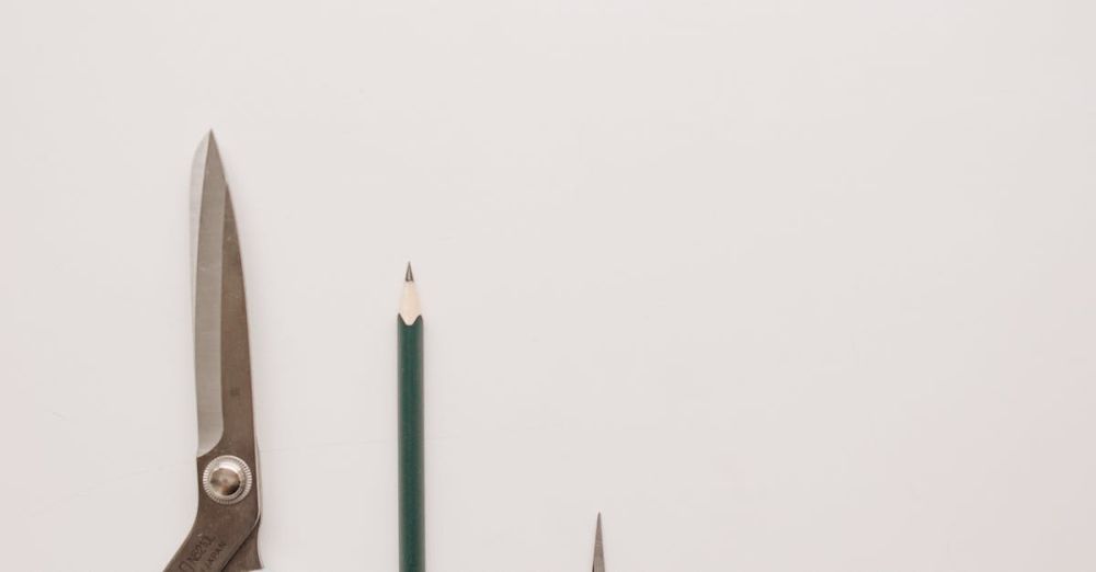 Creative Products - Minimalist photo of essential sewing tools neatly arranged on a neutral background.