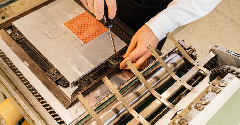 Bookbinding Tools - An artisan in mid-action setting up a printing press, focusing on the intricacies of craftsmanship.