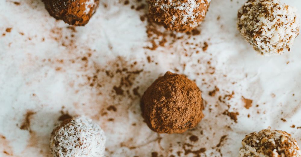 Baking Sheets - An enticing arrangement of homemade chocolate truffles dusted with cocoa and coconut flakes.