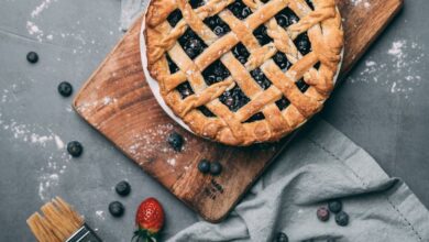 Pastry Brushes - Delicious homemade blueberry pie with fresh strawberries on a rustic wooden board.