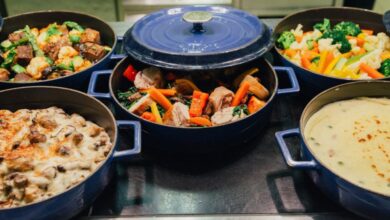 Casserole Dishes - An array of delicious dishes in blue cooking pots, perfect for dinner or a buffet setup.