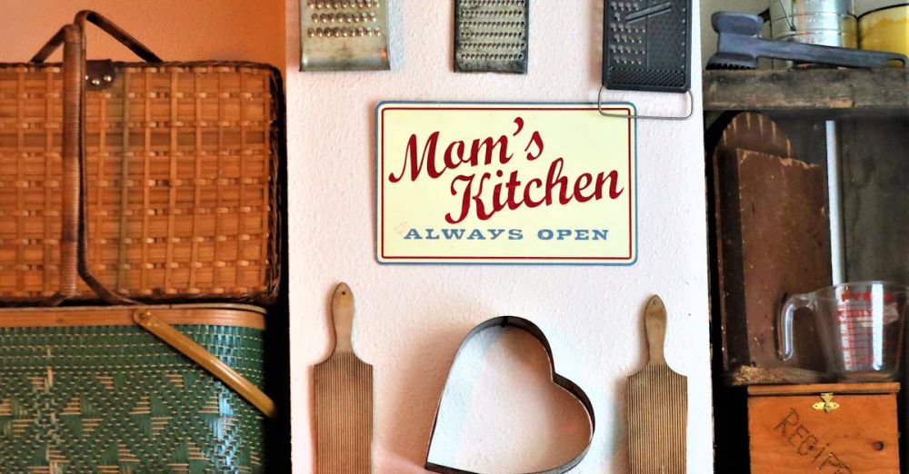 Graters - Charming kitchen wall decor featuring vintage graters, signs, and baskets in a cozy setting.