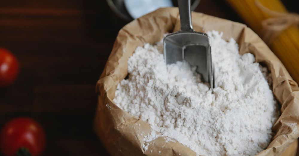 Pasta Tools - A cozy kitchen scene showcasing flour and pasta for cooking, captured from a high angle.