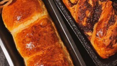 Bread Pans - Delicious homemade sweet breads cooling in trays, perfect for a cozy treat.