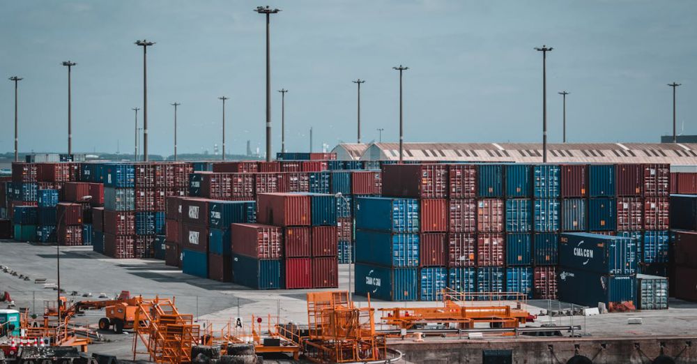 Containers - Colorful cargo containers stacked at a busy industrial port, showcasing global trade.