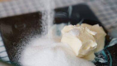 Kitchen Scales - Close-up of sugar and butter being mixed in a glass bowl, perfect for baking tutorials.