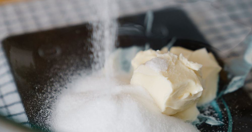 Kitchen Scales - Close-up of sugar and butter being mixed in a glass bowl, perfect for baking tutorials.