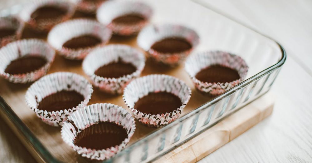 Cupcake Liners - Glass dish with empty muffin liners ready for baking. Ideal for food preparation concepts.