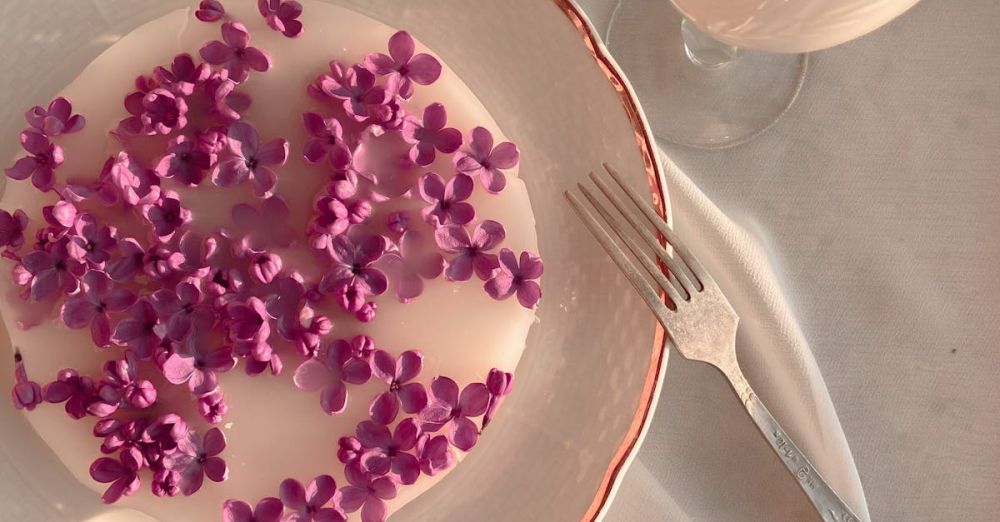 Utensil Sets - A serene breakfast scene featuring lilacs on a plate with a glass of milk, set on white fabric.