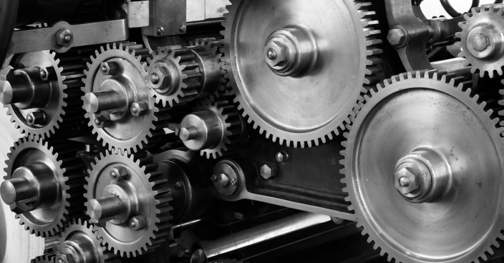 Gear - Close-up view of a complex industrial gear mechanism in black and white.