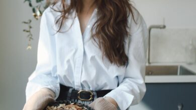 Tart Pans - Young woman holding freshly baked goods, filmed in a modern kitchen setting.