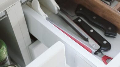 Drawer Dividers - Neatly arranged kitchen drawer with knives and utensils, showcasing effective organization.