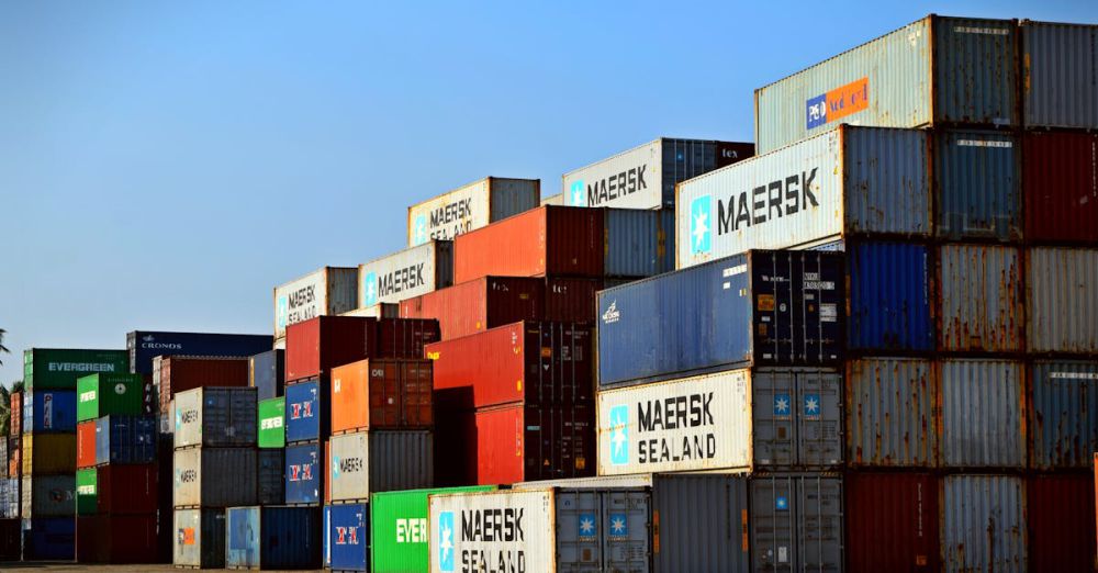 Containers - Colorful stacked shipping containers at a port exemplify global logistics.