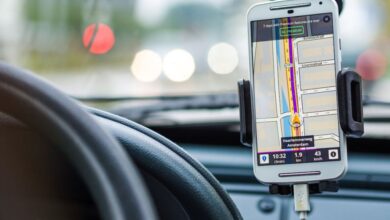 GPS - Smartphone mounted in car using GPS for navigation and directions.
