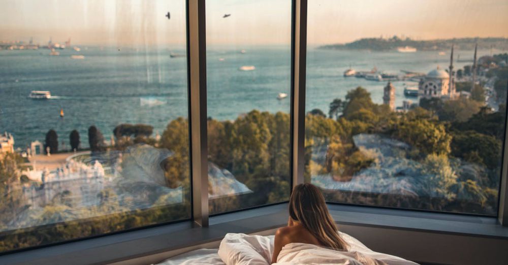 Travel Pillows - Relaxing in a cozy hotel room with stunning views of the Bosphorus at sunset in Istanbul, Turkey.