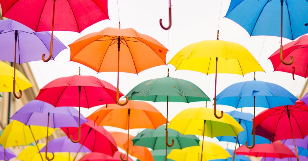 Umbrellas - Colorful umbrellas creating a vivid outdoor installation under bright skies.