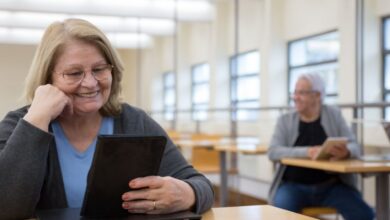 Learning Tablets - Senior adults learning to use tablets at a modern classroom in Portugal.