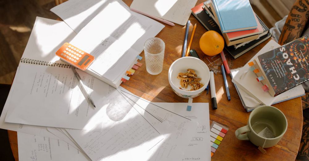 Math Workbooks - A cluttered study table with books, notes, and study materials in natural light for focused exam preparation.