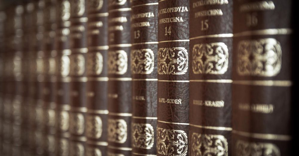 Encyclopedias - A close-up view of vintage encyclopedias on a library bookshelf, highlighting the ornate leather bindings.