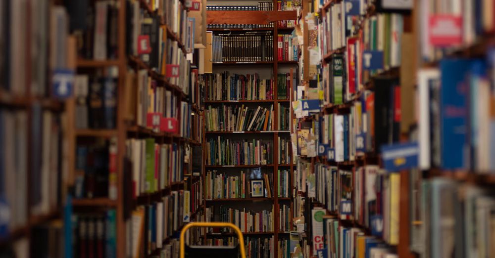 Poetry Collections - Explore an inviting library aisle in Milwaukee, WI, lined with countless books for endless discoveries.