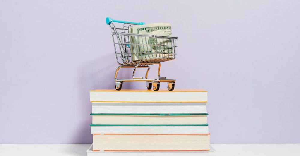 Social Books - A small shopping cart with dollar bills placed on a stack of books, symbolizing financial literacy.