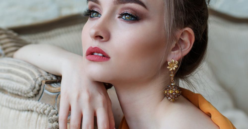 Jewelry - Stunning close-up portrait of a woman with elegant makeup and jewelry, epitomizing modern fashion and beauty.