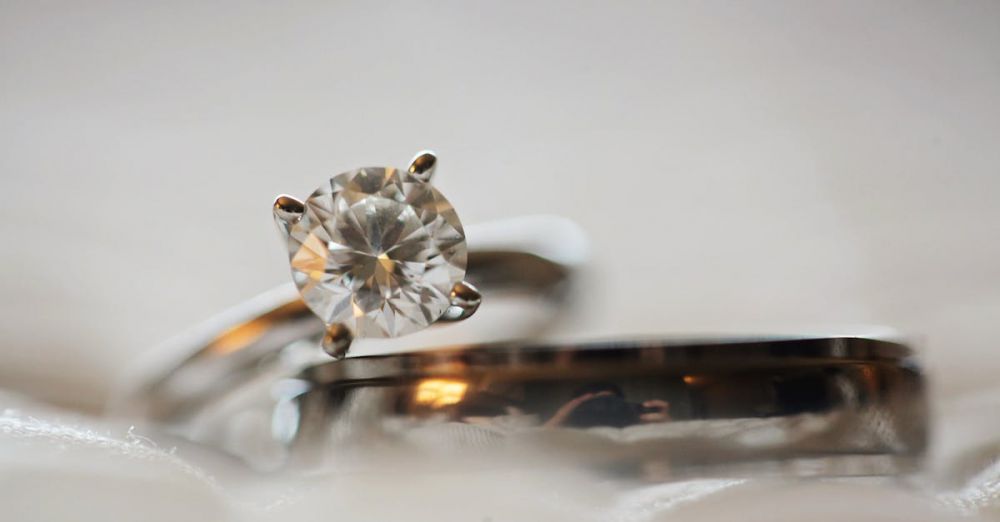 Rings - Elegant macro shot of a diamond engagement ring set with a blurred background.