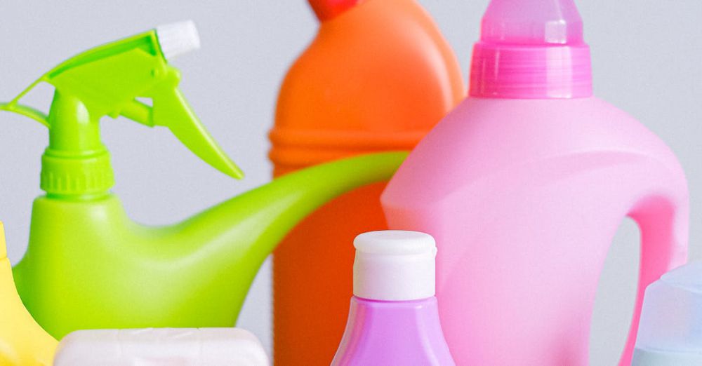 Cleaning Kits - Assorted colorful detergent bottles on a bright white surface.