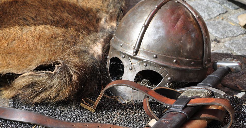 Leather Straps - Close-up of medieval armor, helmet, and sword in a classic setting.