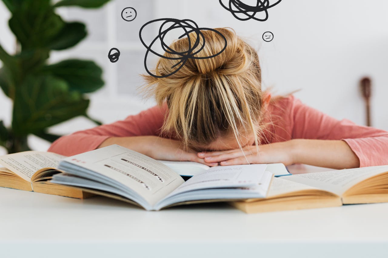 woman-putting-her-head-down-on-the-desk